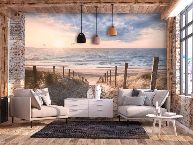 Carta da parati Sabbia ventosa - soleggiato paesaggio con scogliera e mare in sfondo
